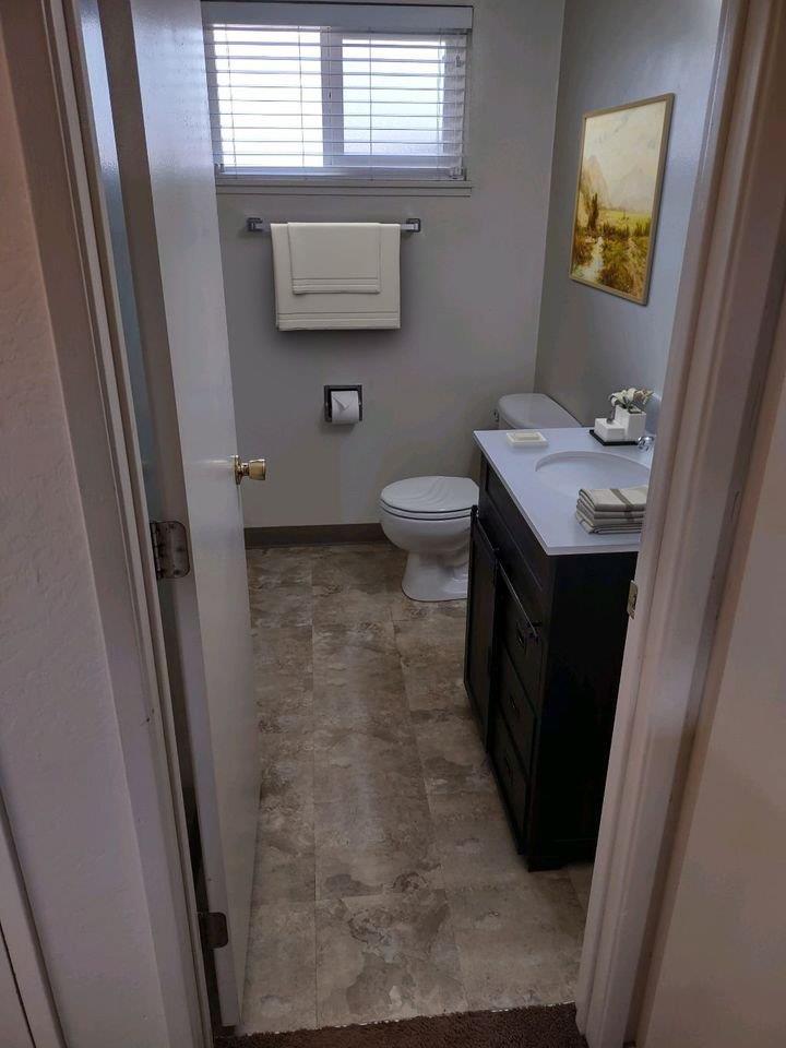 3323 Union Street Fremont, CA 94538 - Photo 26 of 41 a bathroom with a sink a toilet a mirror and window