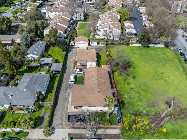 an aerial view of a house with a garden
