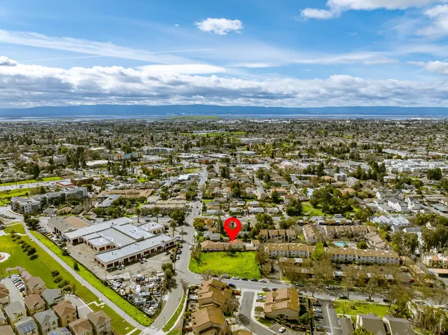 an aerial view of residential houses with outdoor space