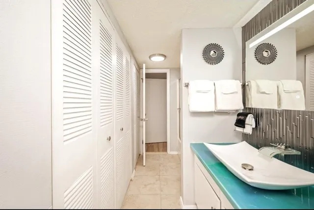 a bathroom with a sink and a mirror