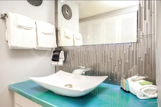 a bathroom with a sink and a window