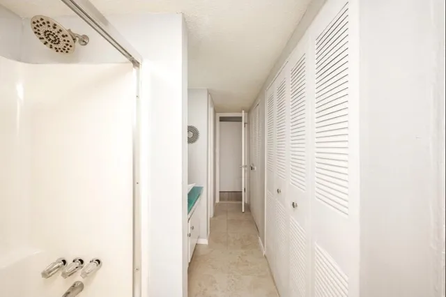 a view of a hallway with closet