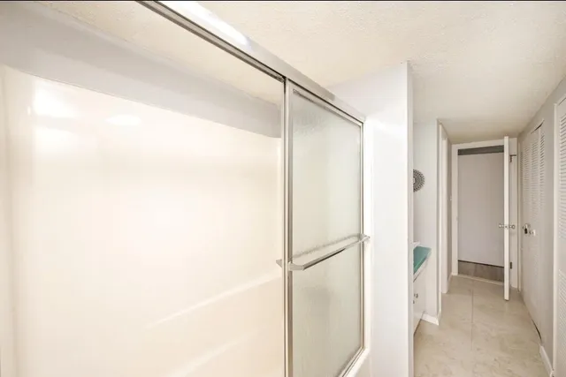 an aerial view of a house with a lake view