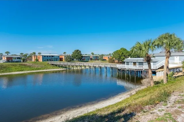 a swimming pool view with a garden space