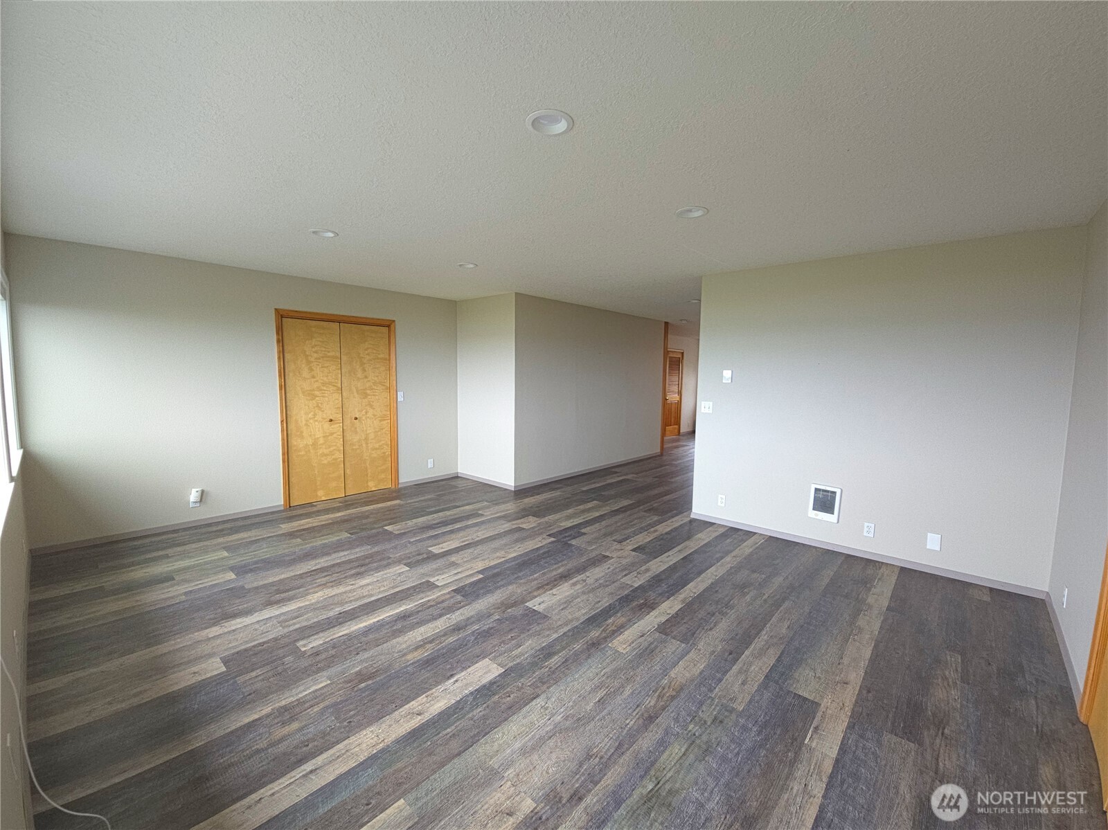 240 Stringtown Road Ilwaco, WA 98624 - Photo 15 of 39 a view of empty room with wooden floor