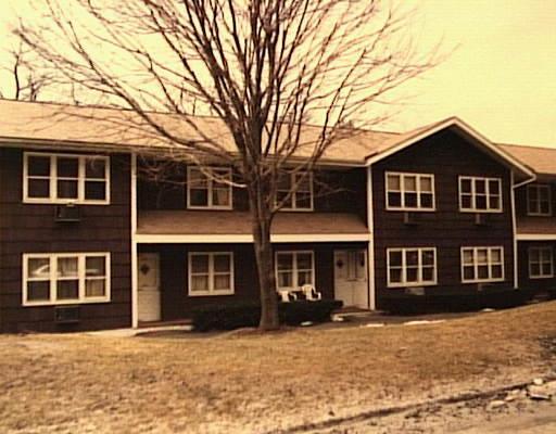 83 Juniper Road, Unit 83 Bethel, CT 06801 - Photo 1 of 1 a front view of a house with a yard
