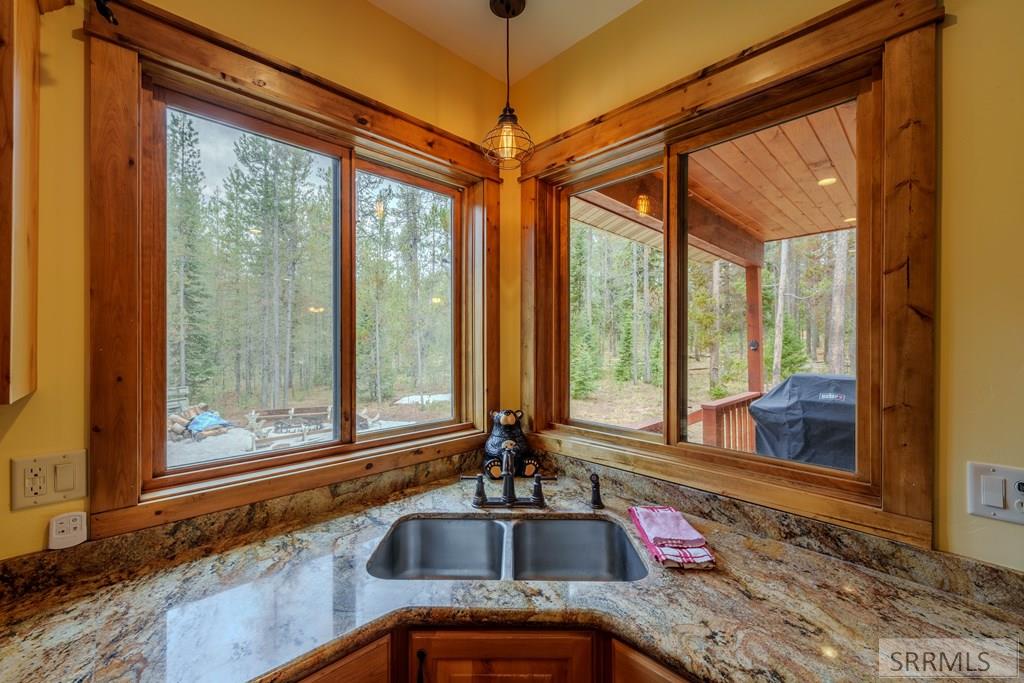 4030 Salt Lick Loop Road Island Park, ID 83429 - Photo 9 of 57 Granite counter tops with corner sink
