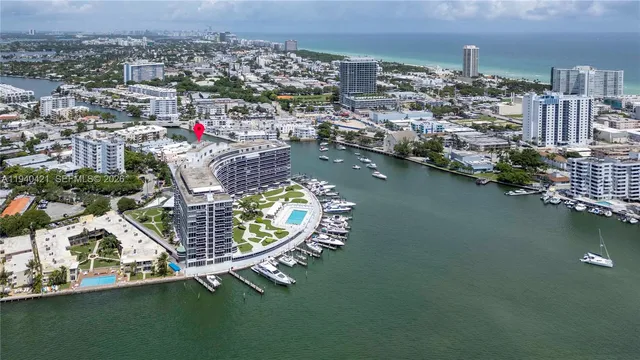 an aerial view of a house with a table chairs and potted plants