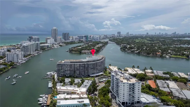 an aerial view of a house with a lake view