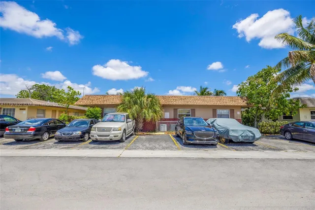 a view of a car parked in front of a house