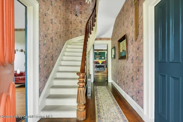 a living room with furniture tv and a window