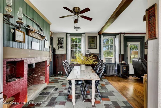 a view of a workspace with furniture and wooden floor