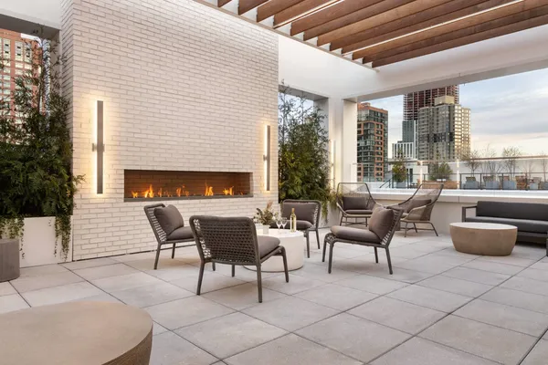 a dining room with furniture and a fireplace