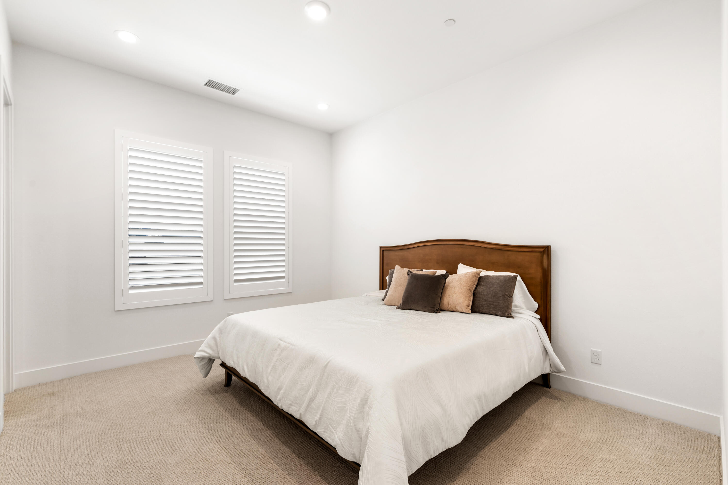 80404 Old Ranch Trail South La Quinta, CA 92253 - Photo 18 of 28 a bedroom with a bed and a window