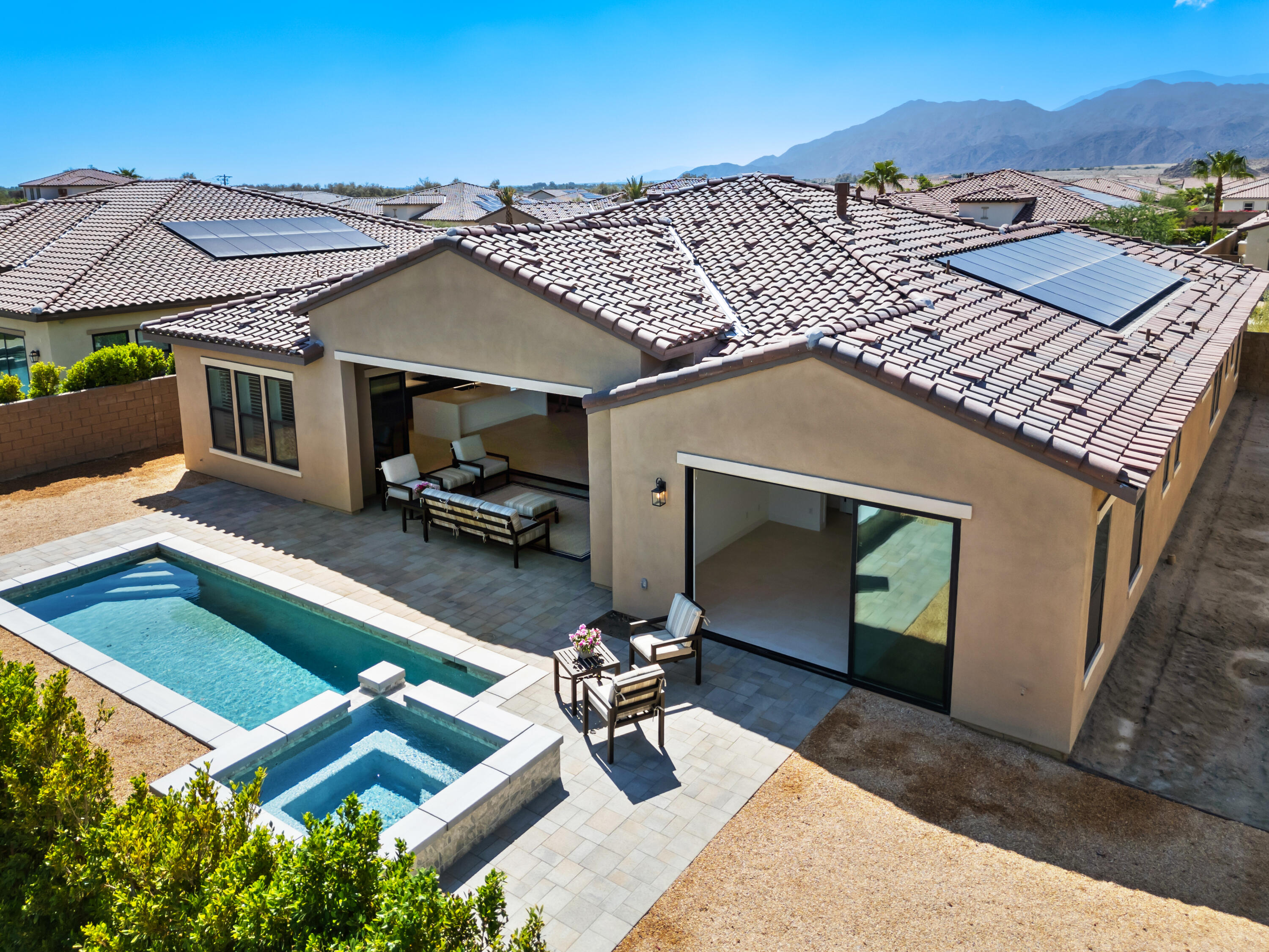 80404 Old Ranch Trail South La Quinta, CA 92253 - Photo 27 of 28 a view of a patio with a table and chairs under an umbrella
