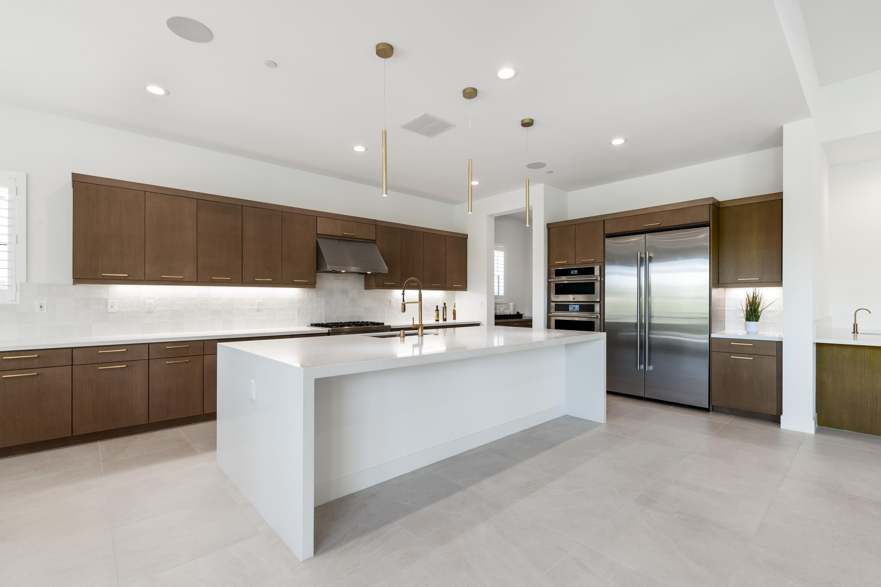 80404 Old Ranch Trail South La Quinta, CA 92253 - Photo 5 of 28 a large kitchen with stainless steel appliances lots of counter space sink and cabinets