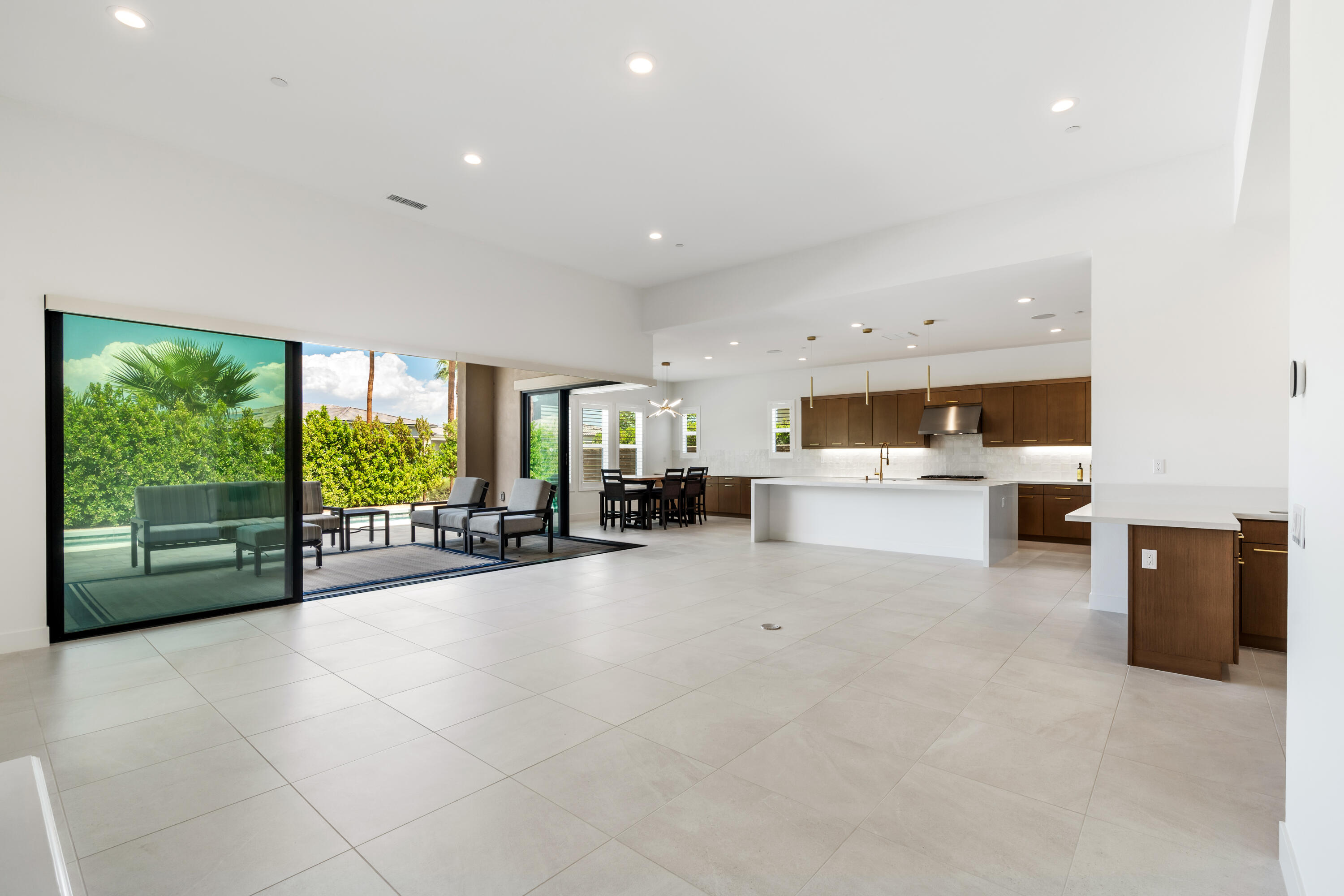 80404 Old Ranch Trail South La Quinta, CA 92253 - Photo 7 of 28 a living room with furniture and large windows