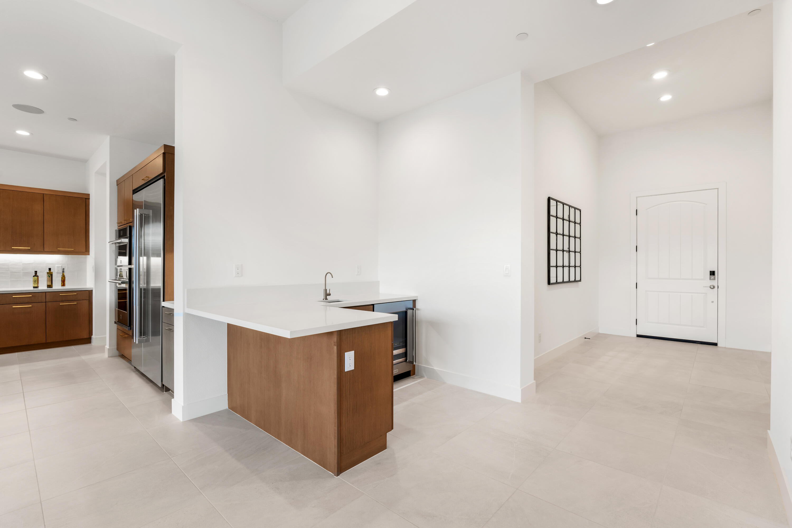 80404 Old Ranch Trail South La Quinta, CA 92253 - Photo 8 of 28 a kitchen with stainless steel appliances a sink and a refrigerator