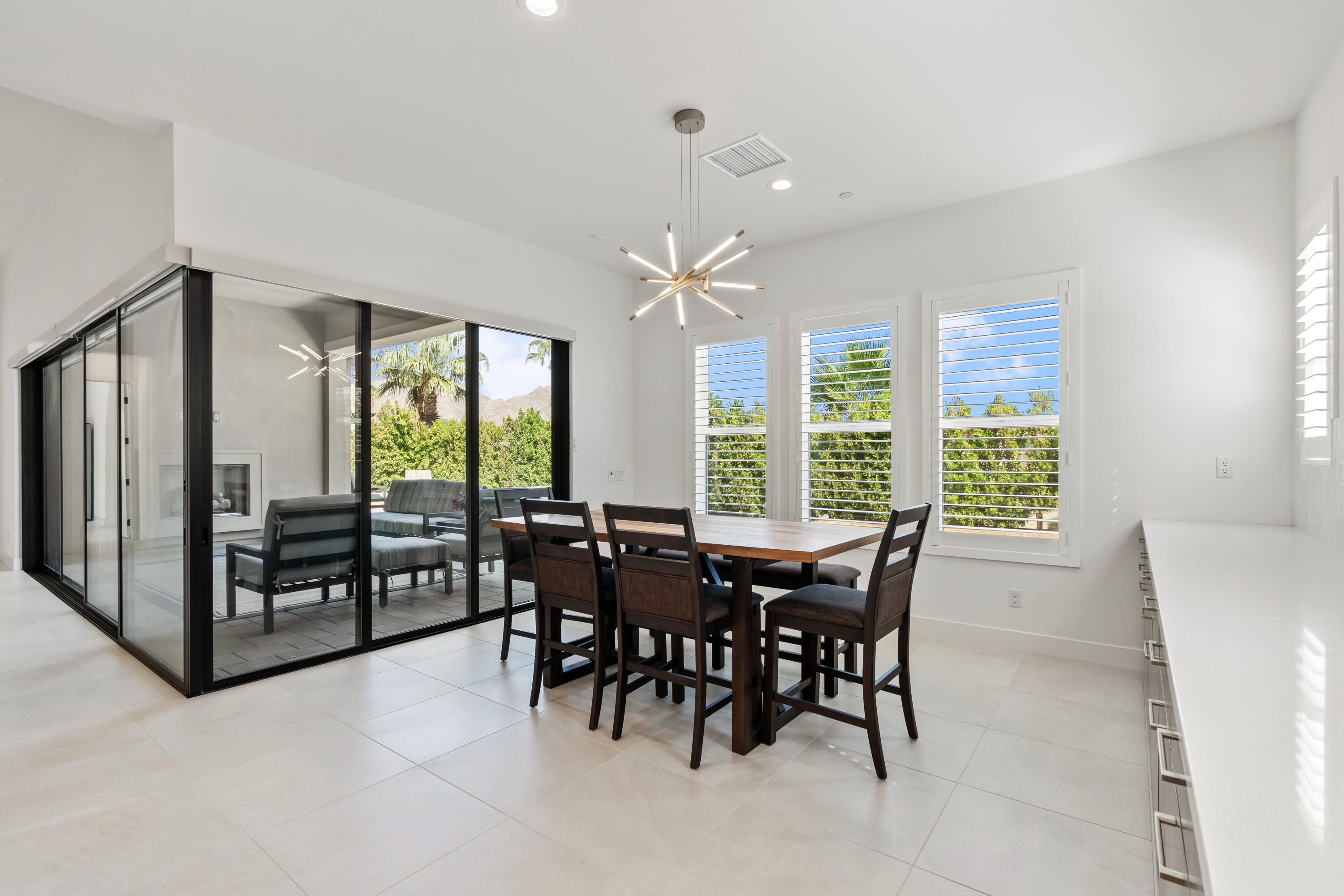 80404 Old Ranch Trail South La Quinta, CA 92253 - Photo 9 of 28 a view of a dining room with furniture window and outside view