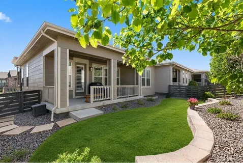 a view of a house with a backyard