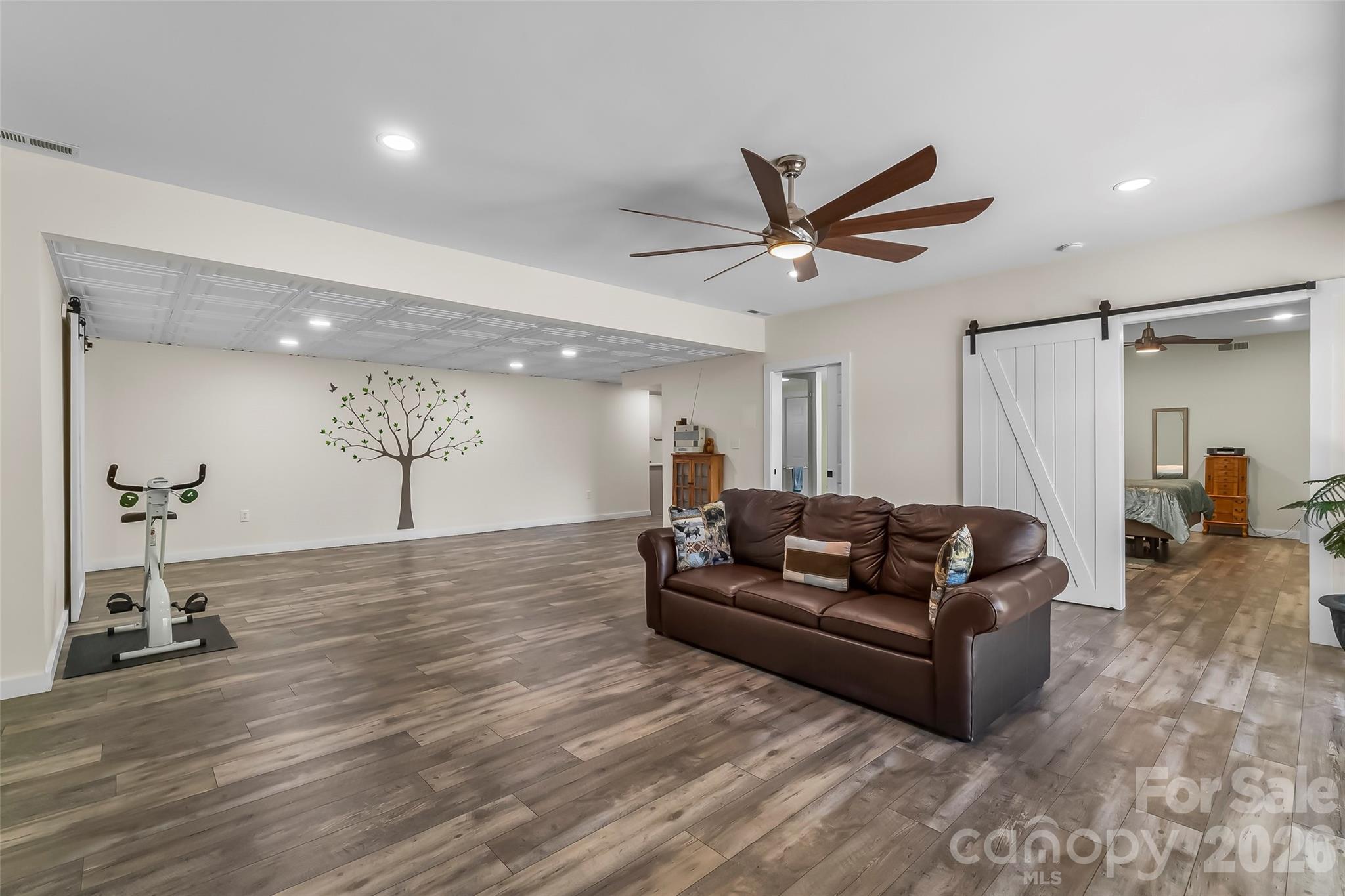 4639 Harbor View Terrace Morganton, NC 28655 - Photo 17 of 33 a living room with furniture and a wooden floor