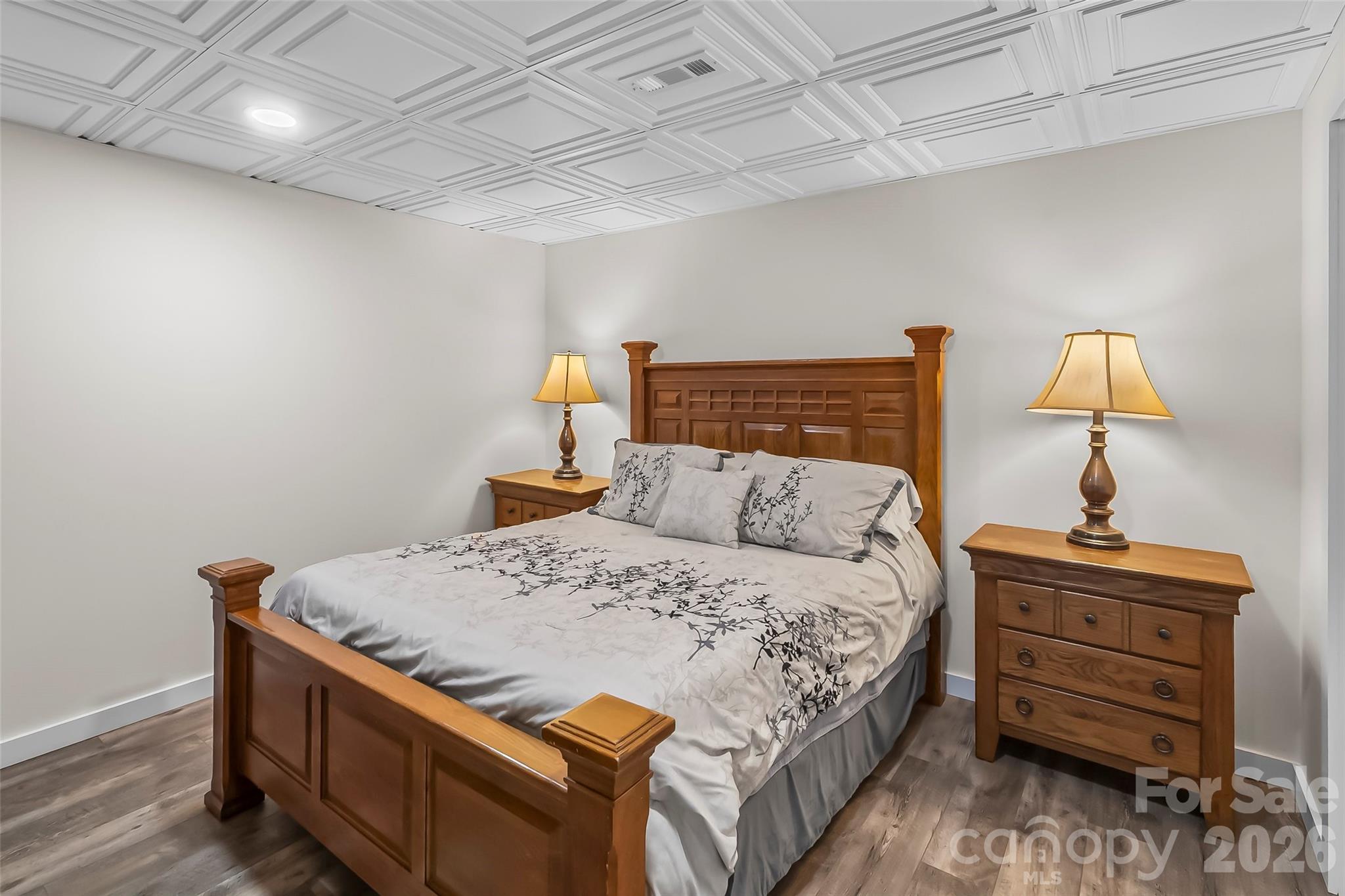 4639 Harbor View Terrace Morganton, NC 28655 - Photo 24 of 33 a bedroom with a bed and a lamp on dresser