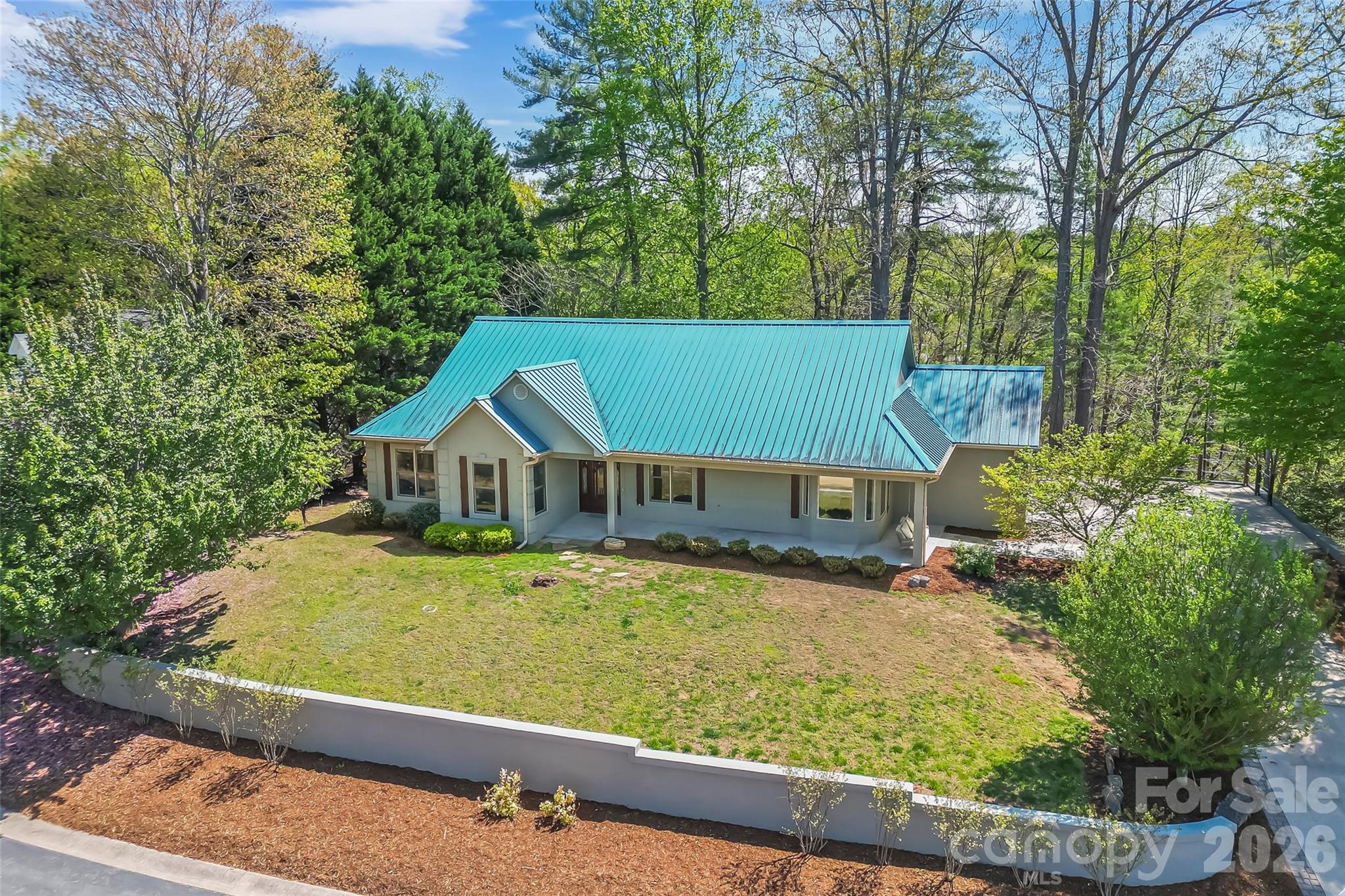 4639 Harbor View Terrace Morganton, NC 28655 - Photo 28 of 33 a view of a house with a big yard plants and large trees