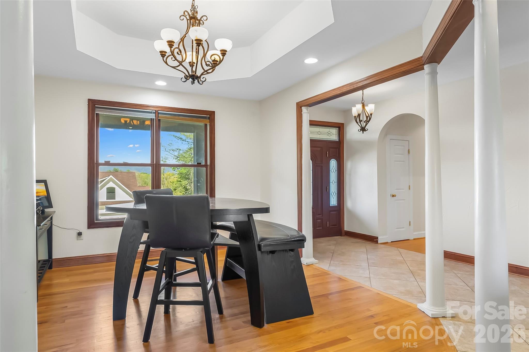 4639 Harbor View Terrace Morganton, NC 28655 - Photo 9 of 33 a view of a dining room with furniture a chandelier and wooden floor