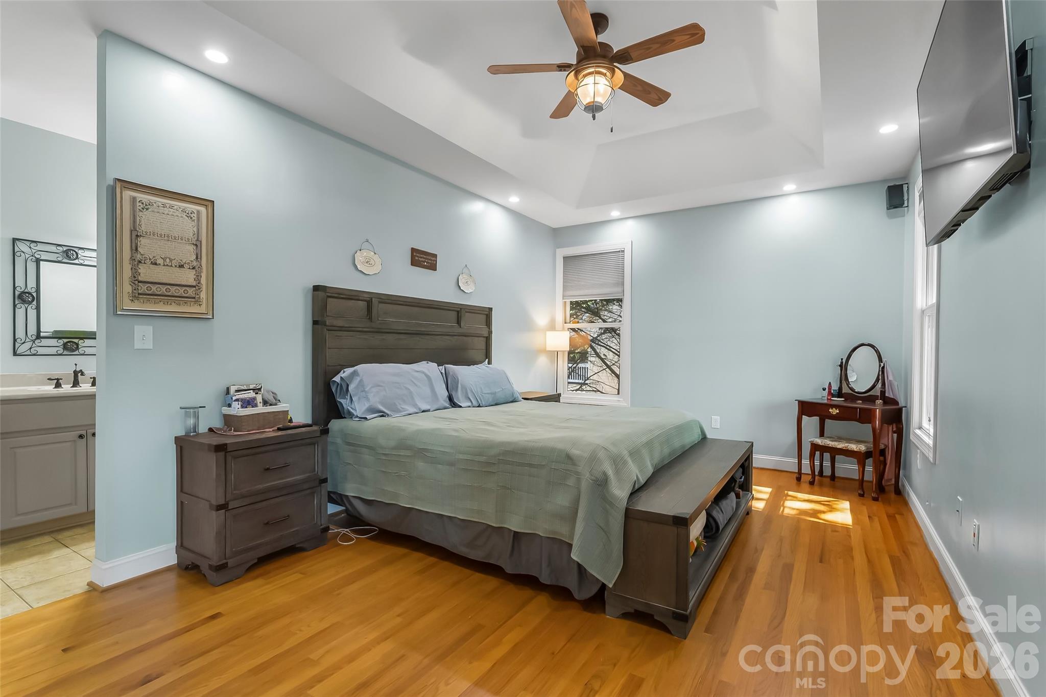 4639 Harbor View Terrace Morganton, NC 28655 - Photo 10 of 33 a spacious bedroom with a bed and a chandelier