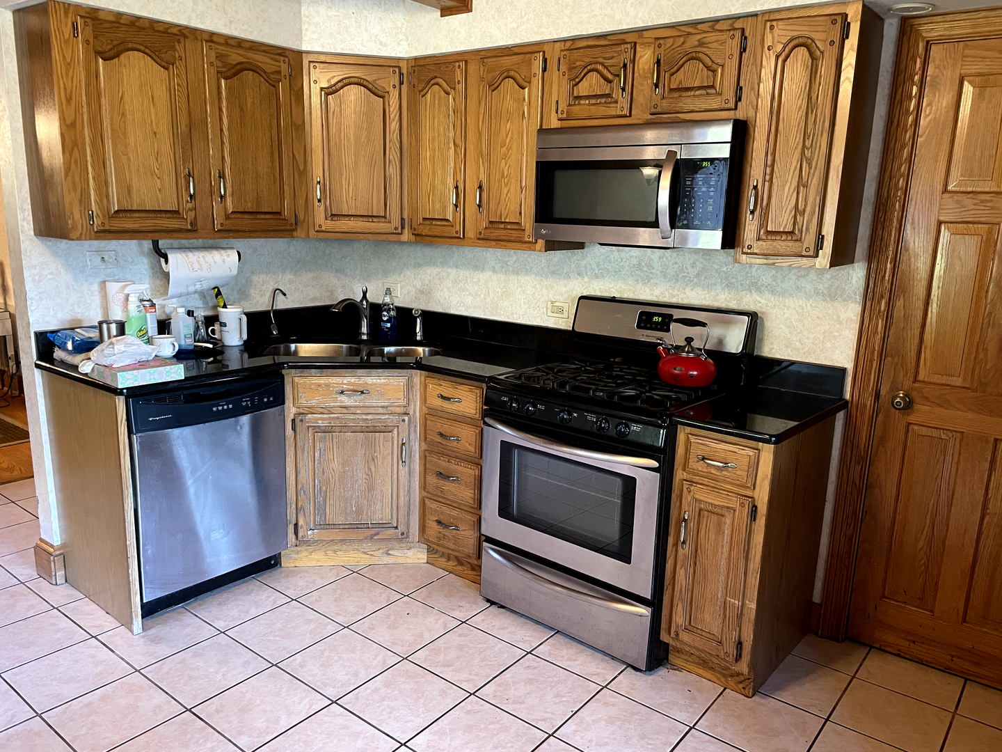 2502 Van Drunen Lane Crete, IL 60417 - Photo 14 of 58 a kitchen with a stove and a microwave
