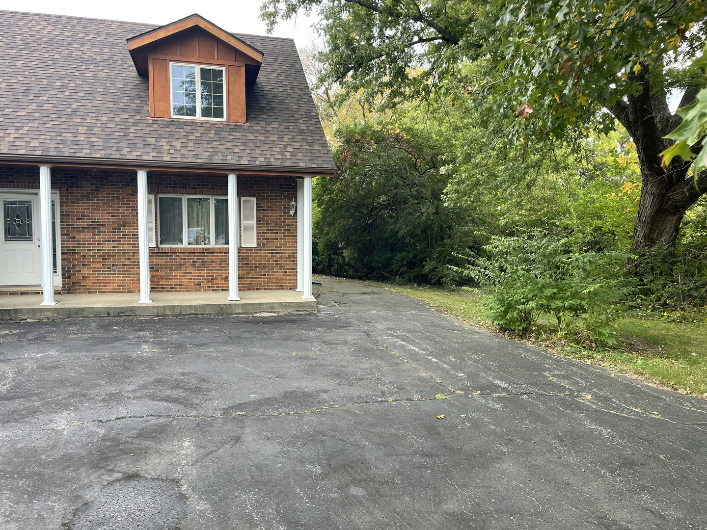 2502 Van Drunen Lane Crete, IL 60417 - Photo 2 of 58 a front view of a house with a yard and garage