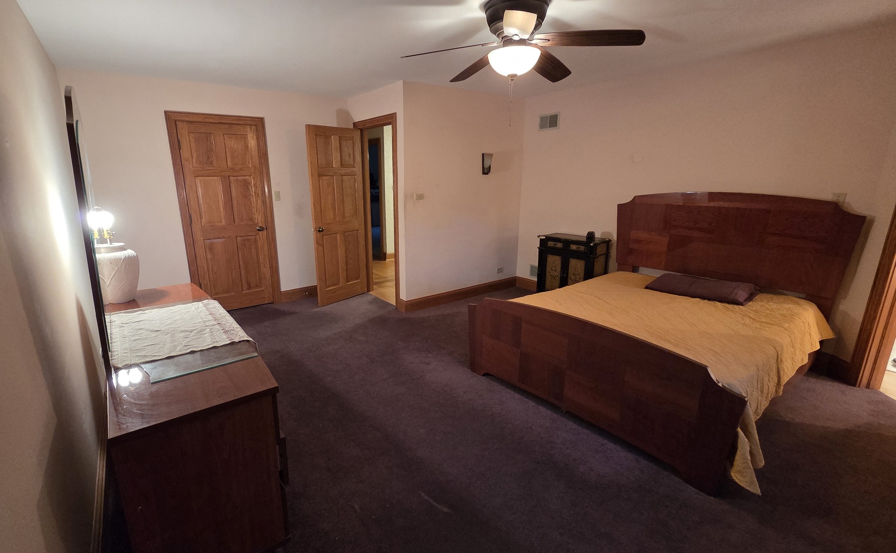 2502 Van Drunen Lane Crete, IL 60417 - Photo 32 of 58 a bedroom with a bed and a chandelier