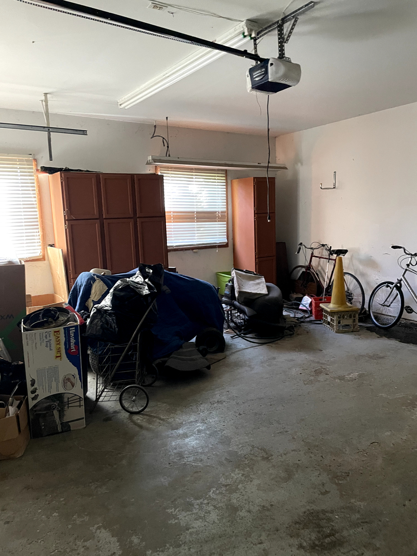 2502 Van Drunen Lane Crete, IL 60417 - Photo 56 of 58 a living room with furniture a window and gym cycle