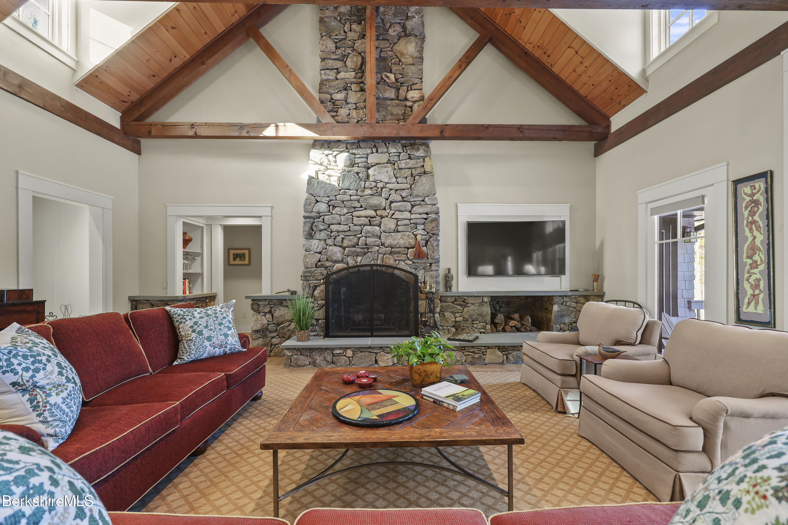 201 Stratford Road New Marlborough, MA 01259 - Photo 13 of 77 a living room with furniture a fireplace and a flat screen tv