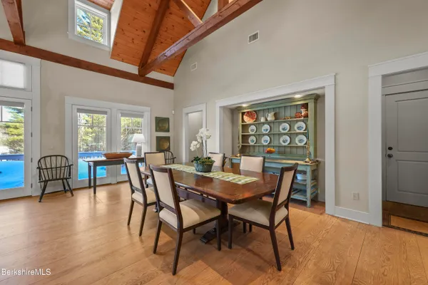 a view of a dining room with furniture window and outside view