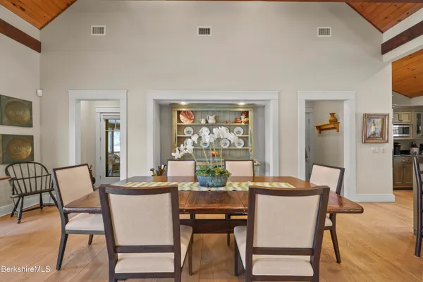 a view of a dining room with furniture window and outside view