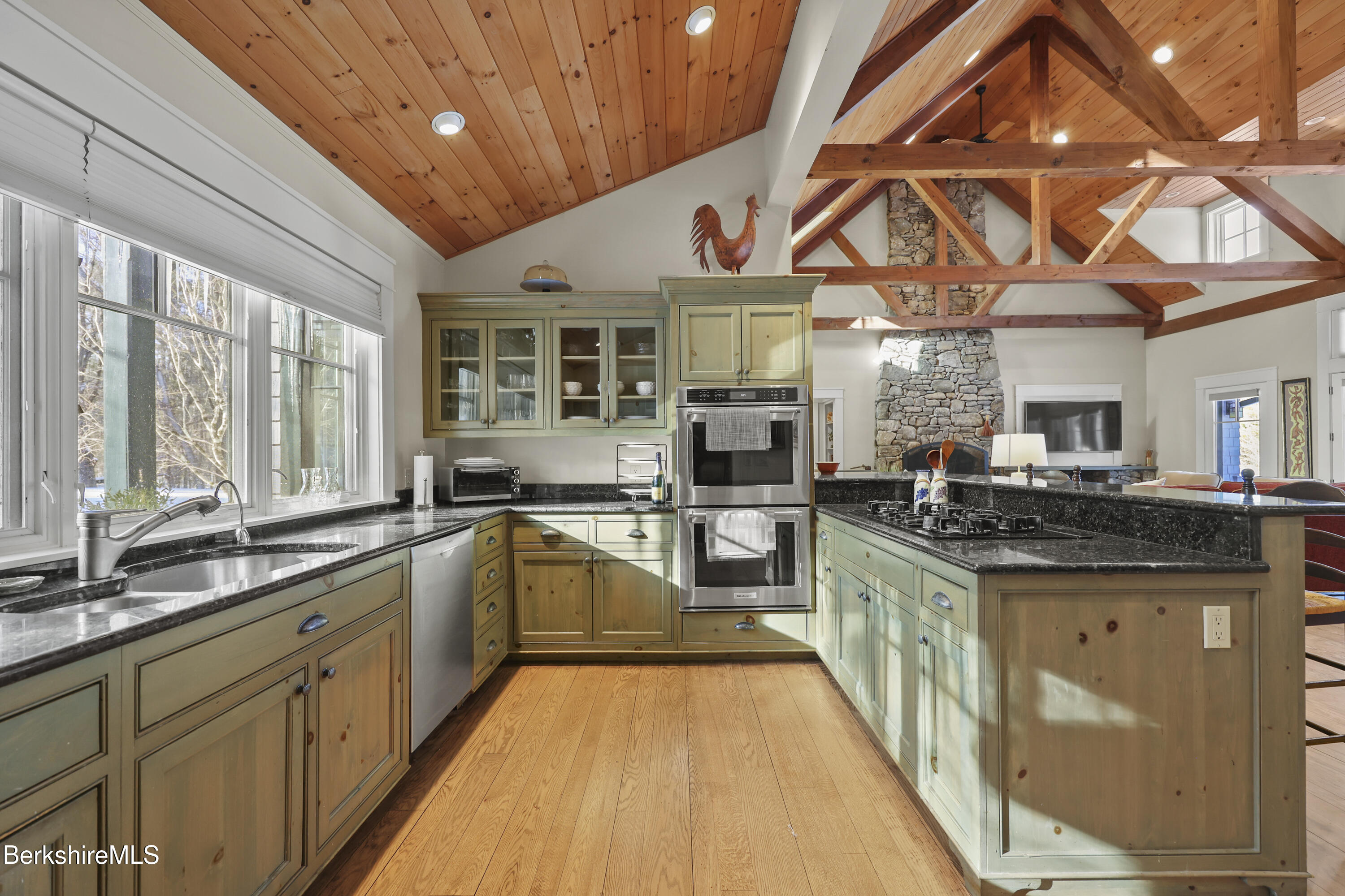 201 Stratford Road New Marlborough, MA 01259 - Photo 23 of 77 a large kitchen with stainless steel appliances granite countertop a large stove a sink dishwasher and cabinets with wooden floor