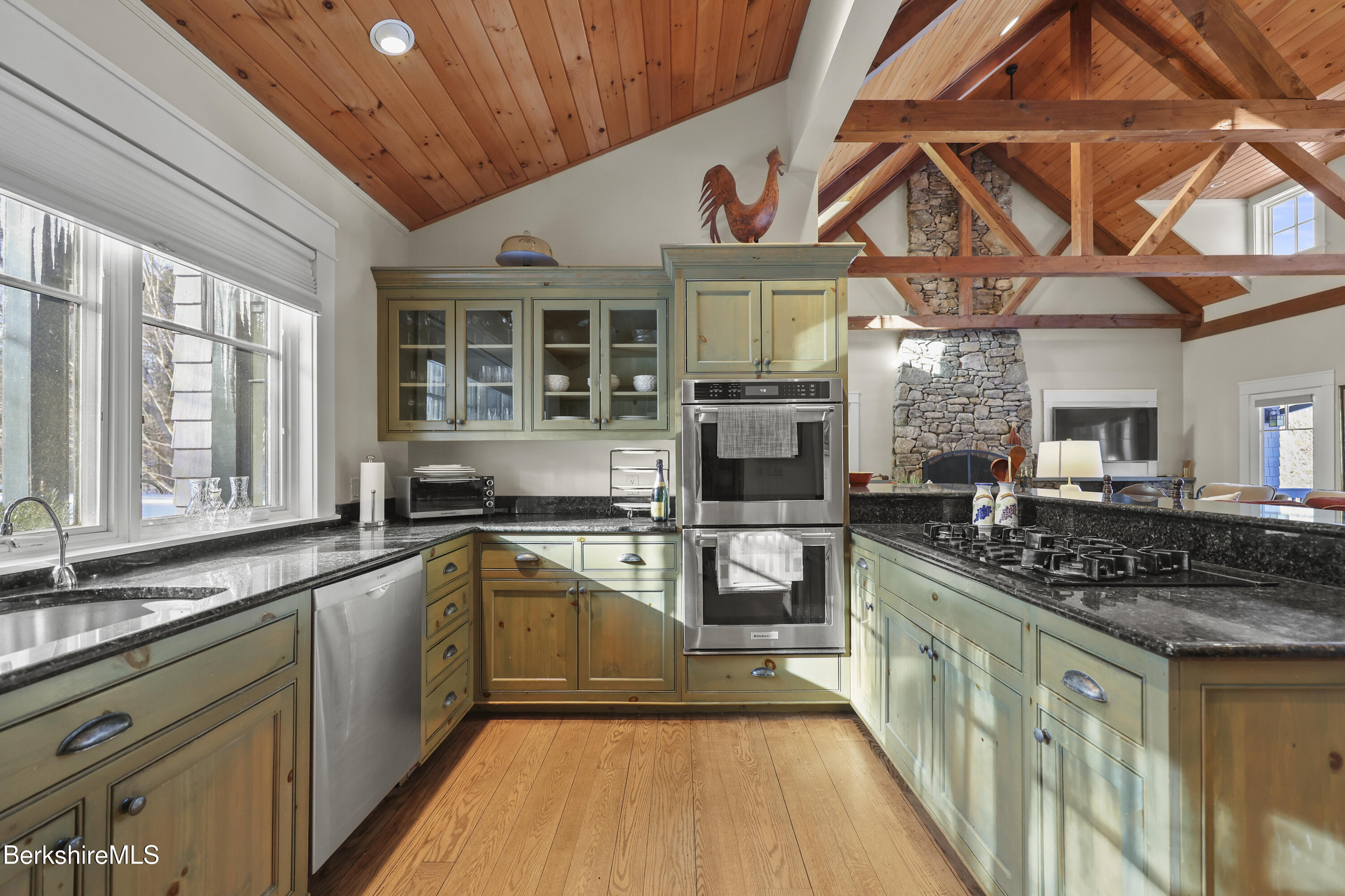 201 Stratford Road New Marlborough, MA 01259 - Photo 24 of 77 a kitchen with stainless steel appliances granite countertop a stove a sink and a microwave