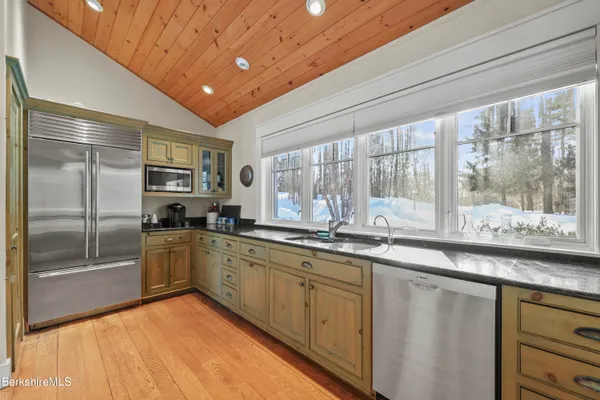 a living room with furniture a lamp and a window
