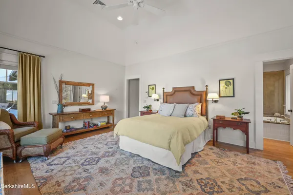 a bedroom with a bed and furniture