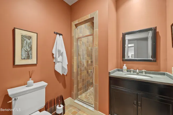 a front view of a house with yard and balcony