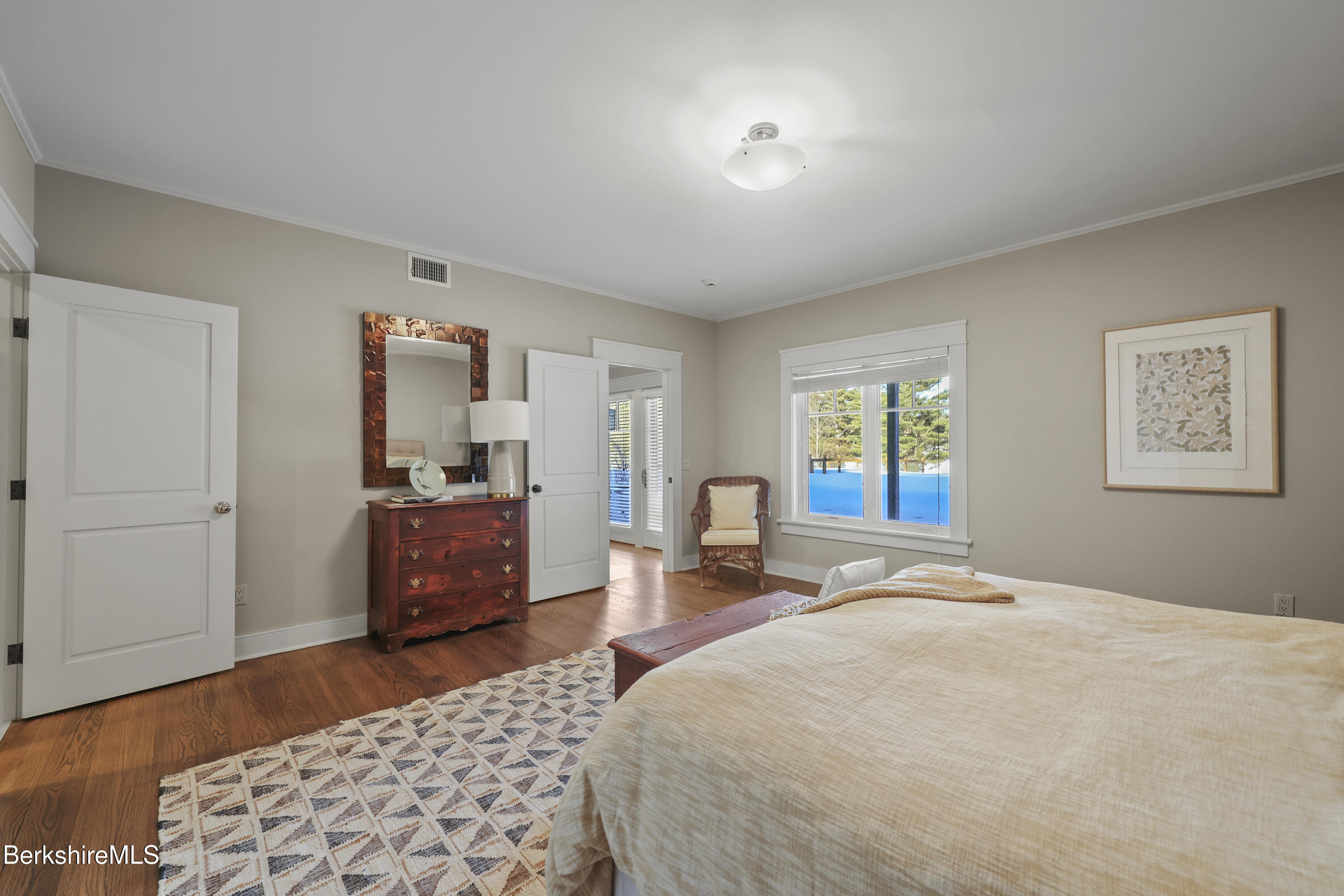 201 Stratford Road New Marlborough, MA 01259 - Photo 48 of 77 a bedroom with a bed and wooden floor