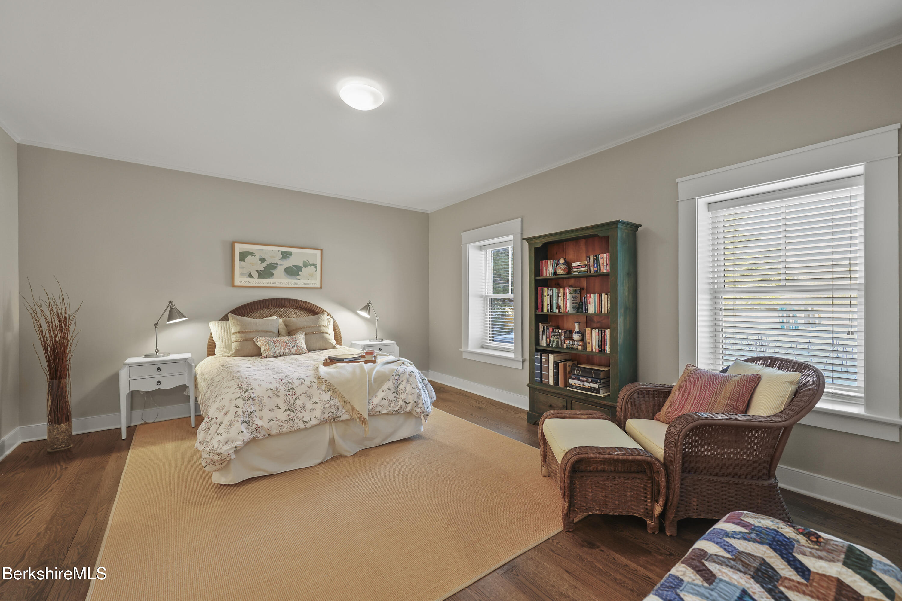 201 Stratford Road New Marlborough, MA 01259 - Photo 51 of 77 a spacious bedroom with a bed a couch and a bookshelf