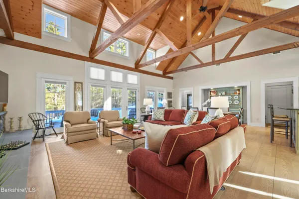 a living room with furniture and a ceiling fan