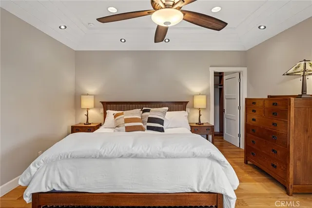 a bedroom with a bed and cabinet