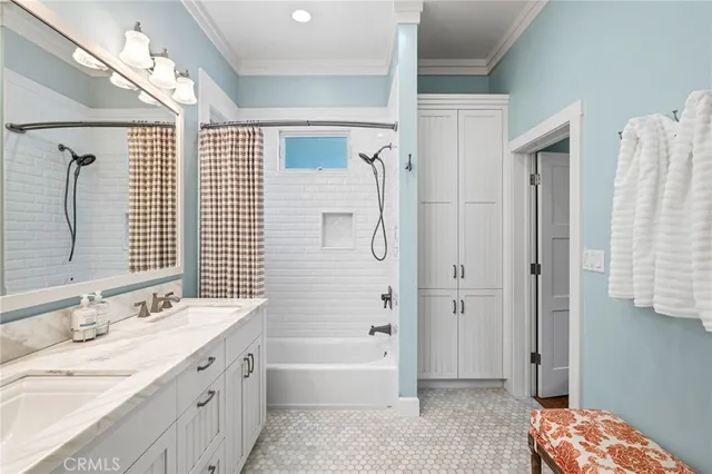 a bathroom with a sink mirror and toilet