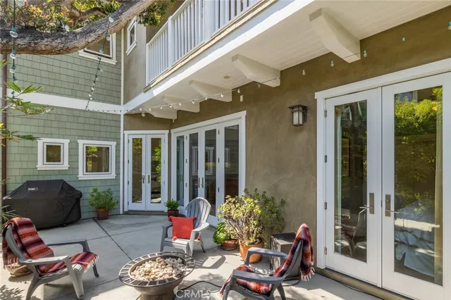 a view of a house with potted plants