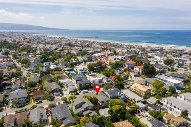 a view of a dining room with table and chairs