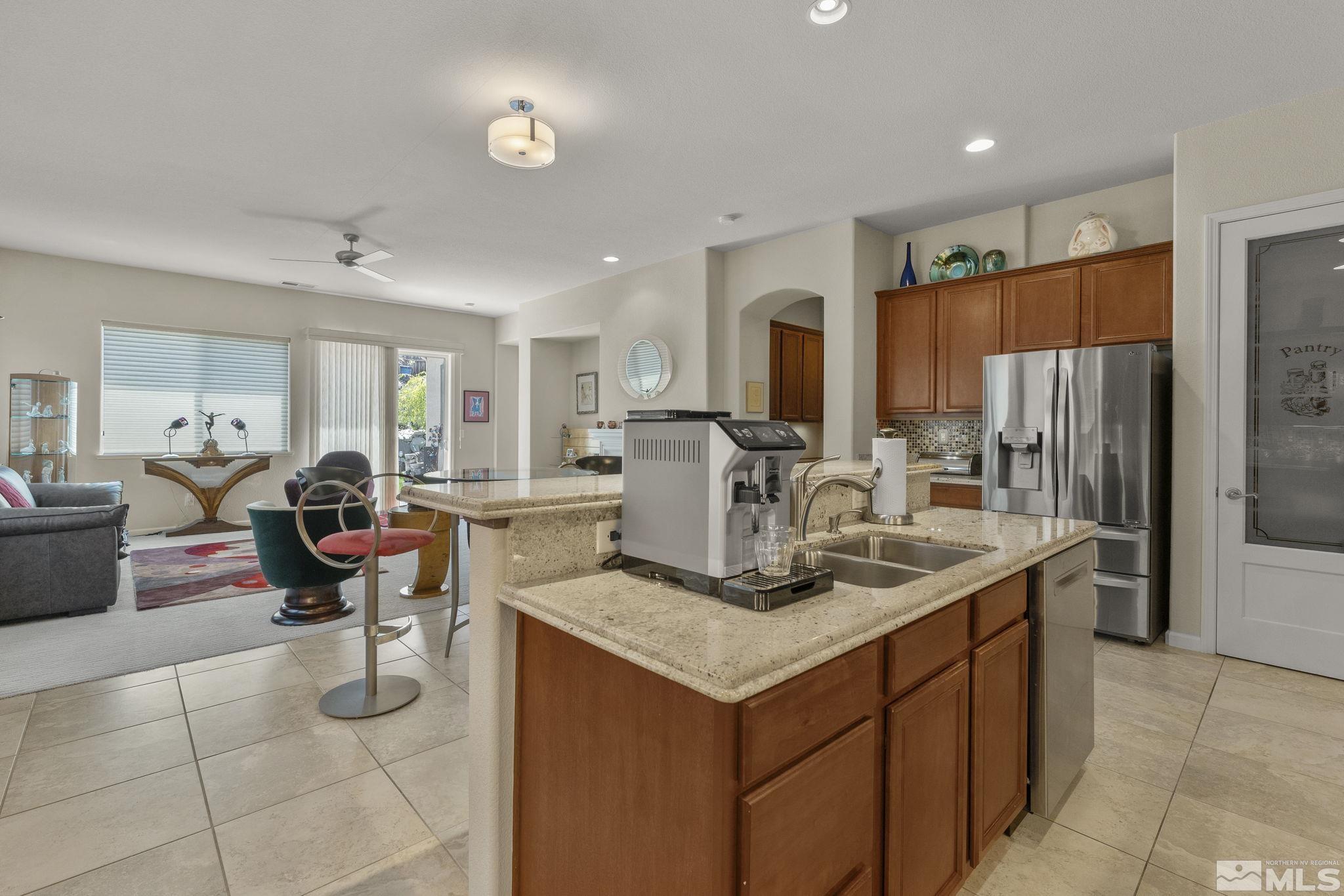 2601 Mule Circle Reno, NV 89521 - Photo 3 of 35 a kitchen with a refrigerator and a sink