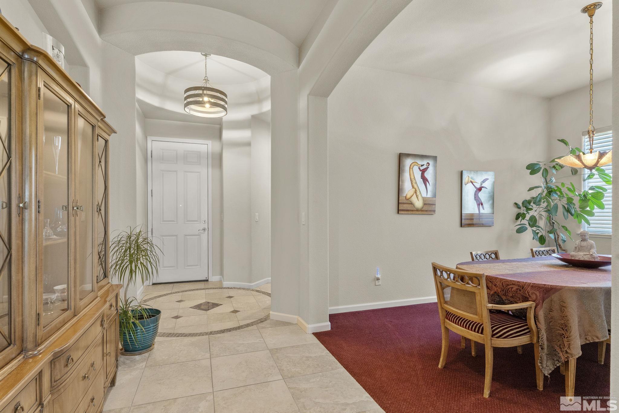 2601 Mule Circle Reno, NV 89521 - Photo 9 of 35 a dining room with furniture and wooden floor